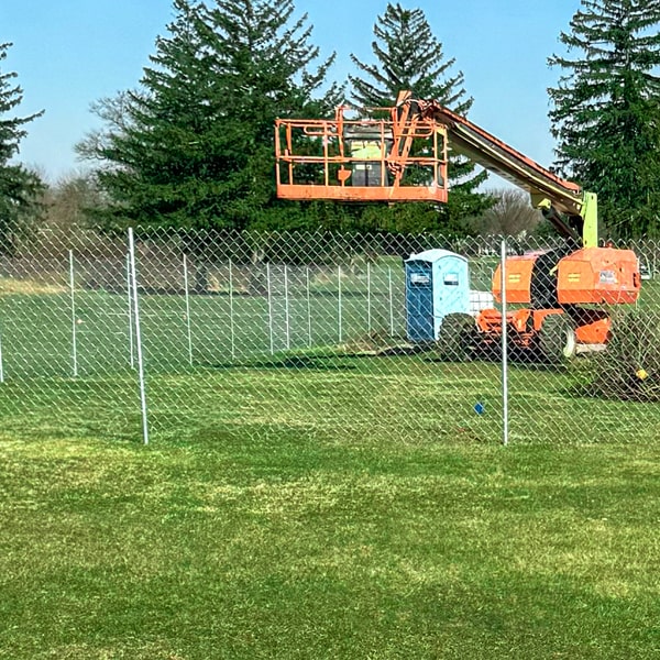 a temporary chain link fence is a portable fence made up of interlocking steel material that is designed to provide a temporary barrier for both commercial or residential properties